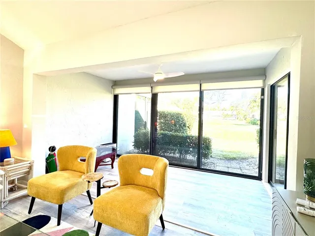 a dining room with table chairs and wooden floor