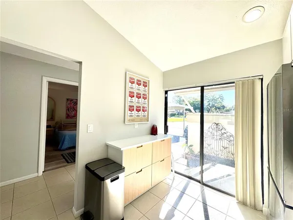 a view of a workspace with furniture and wooden floor