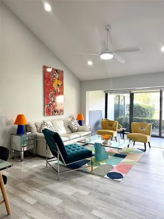 a kitchen with stainless steel appliances a stove a sink and a microwave