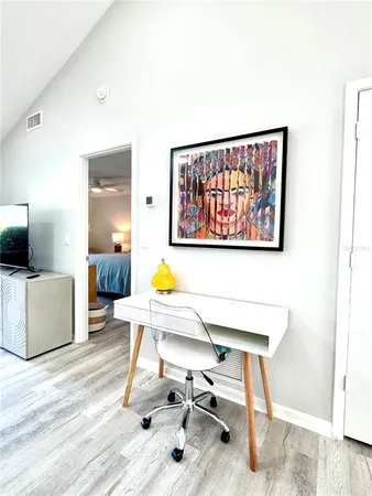 a kitchen with a sink window and stainless steel appliances