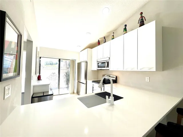 a bedroom with a flat screen television and a bed