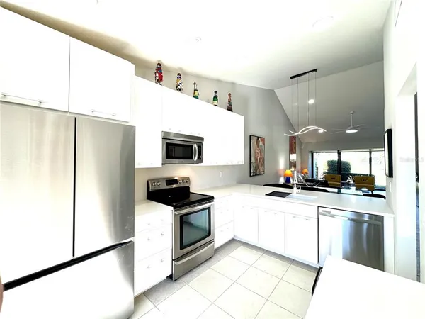 a bedroom with furniture and a flat screen tv