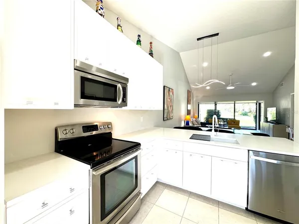 a bedroom with a bed and large windows