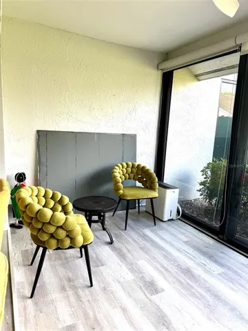 a view of a swimming pool with an outdoor space and seating area