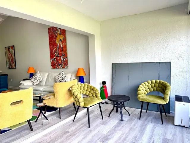 a view of a swimming pool with an outdoor space and seating area