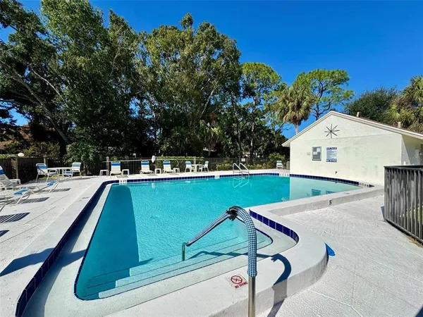 a view of swimming pool with a patio