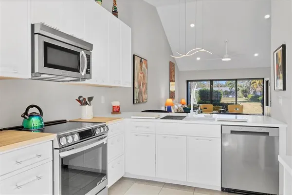 a bathroom with a granite countertop sink mirror and a bathtub