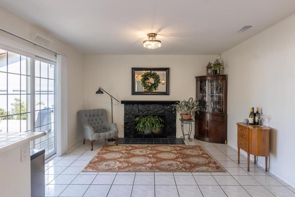 4872 Tarragon Drive Oceanside, CA 92057 - Photo 11 of 25 a living room with furniture and a fireplace