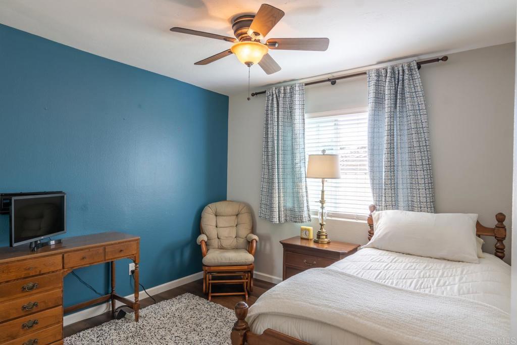 4872 Tarragon Drive Oceanside, CA 92057 - Photo 16 of 25 a bedroom with a bed and a window