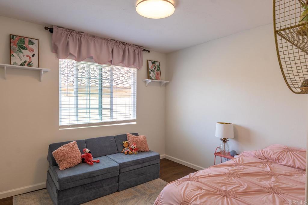 4872 Tarragon Drive Oceanside, CA 92057 - Photo 17 of 25 a bedroom with bed and a window