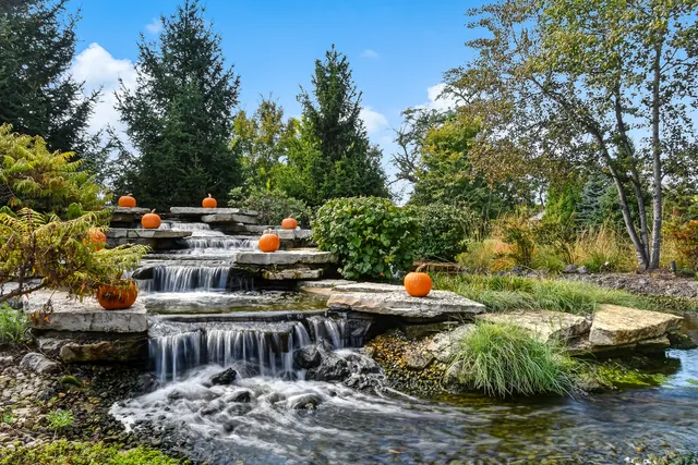 a view of swimming pool with a yard and sitting area