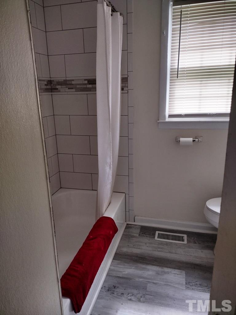 182 Young Road Angier, NC 27501 - Photo 9 of 13 a bathroom with a bathtub