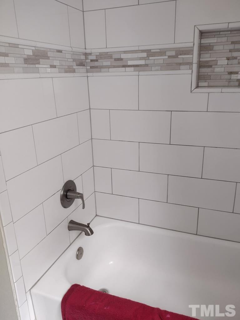 182 Young Road Angier, NC 27501 - Photo 10 of 13 a bathroom with a bathtub