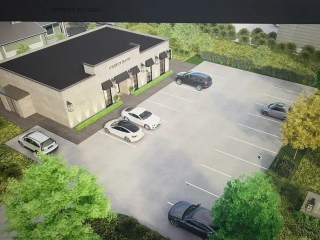 an aerial view of a house with garden space and street view