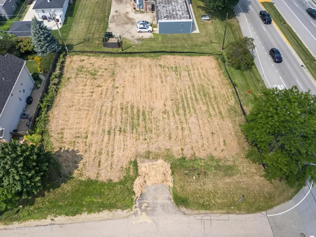 an aerial view of a house with outdoor space