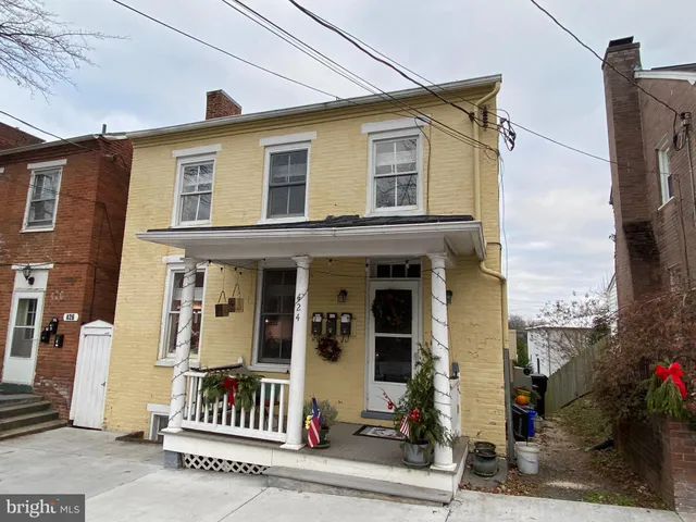 a front view of a house with a porch