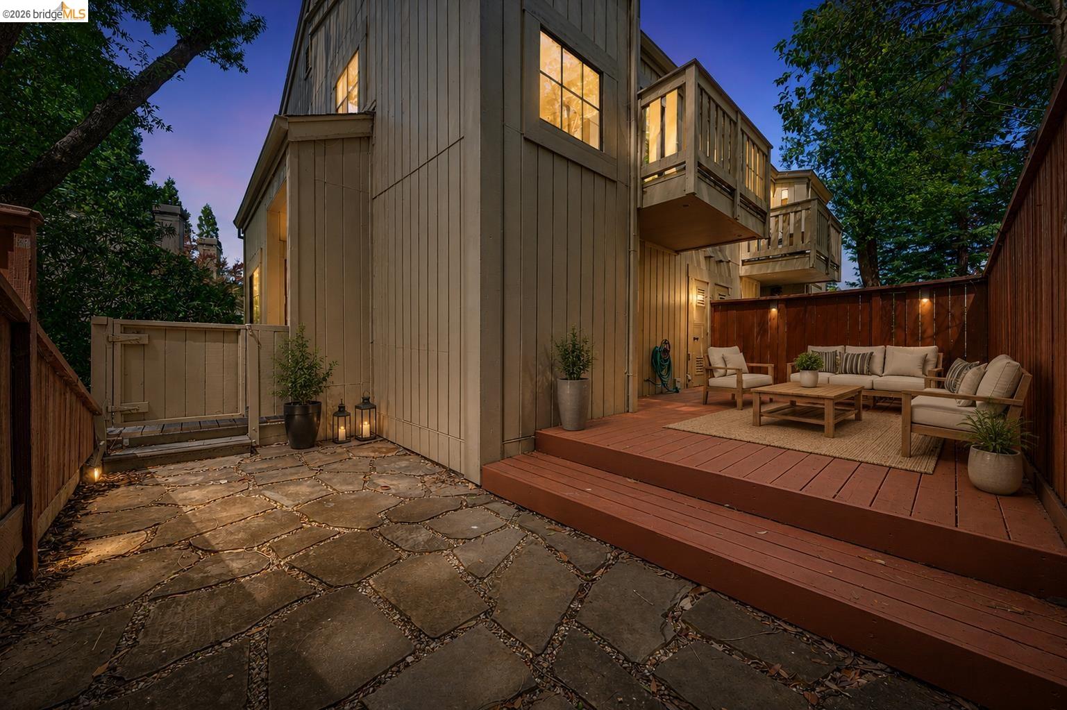 261 Redhawk Road Novato, CA 94949 - Photo 6 of 44 Spacious outdoor living area featuring flagstone paving, a multi-level wood deck, and a privacy fence