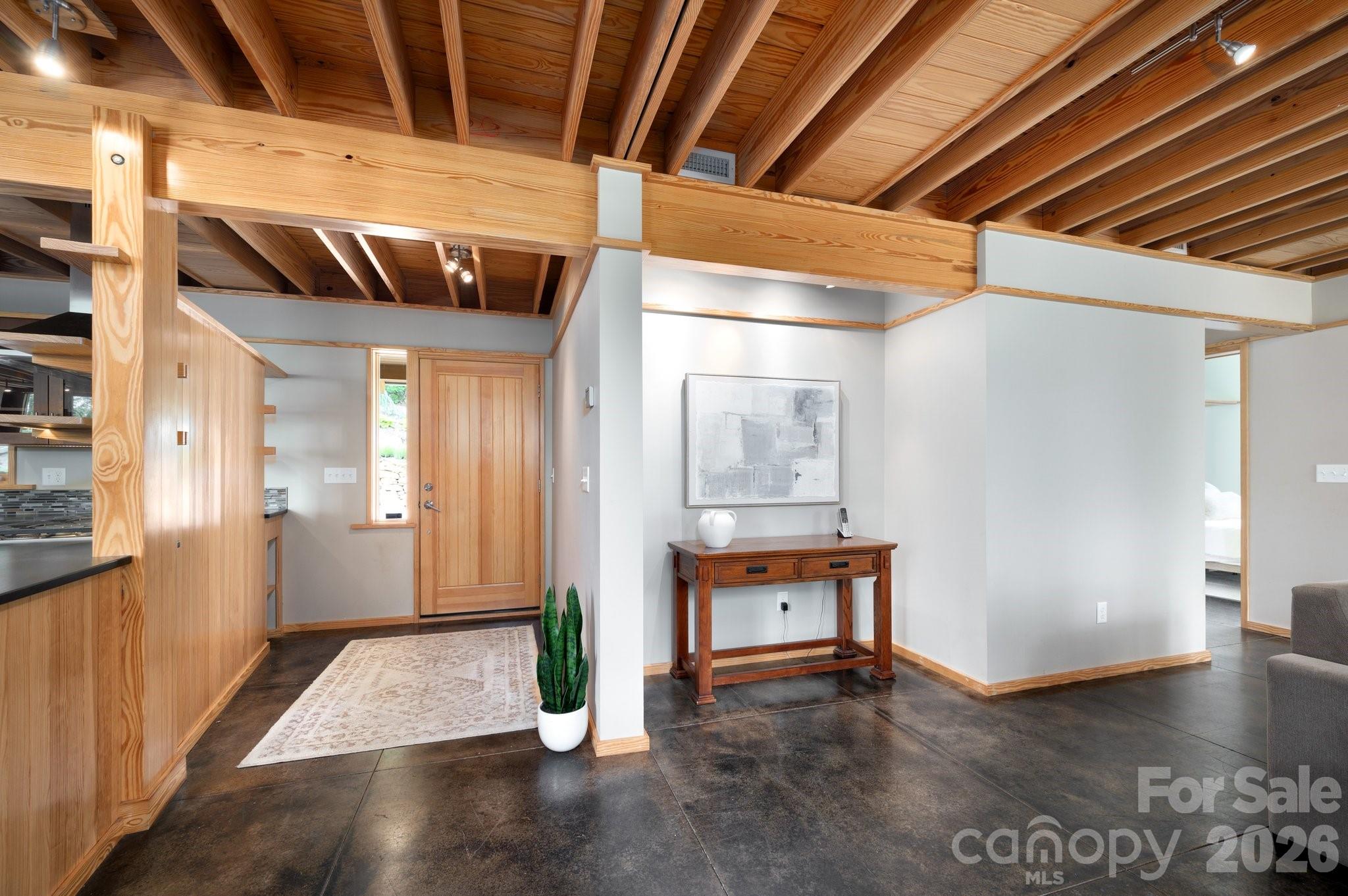 588 Long Branch Road Swannanoa, NC 28778 - Photo 12 of 46 a view of an empty room with wooden floor and a window