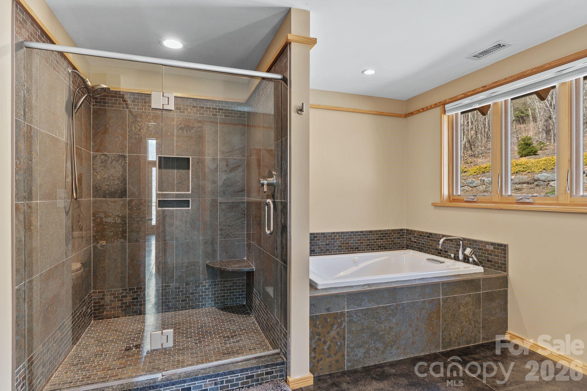 588 Long Branch Road Swannanoa, NC 28778 - Photo 18 of 46 a bathroom with a tub and a shower