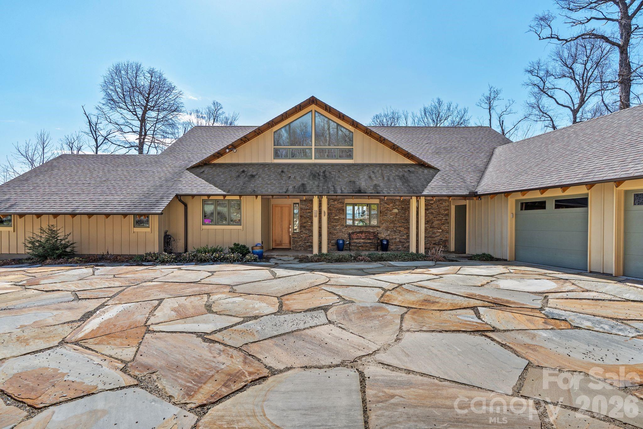 588 Long Branch Road Swannanoa, NC 28778 - Photo 2 of 46 a front view of a house with yard and trees