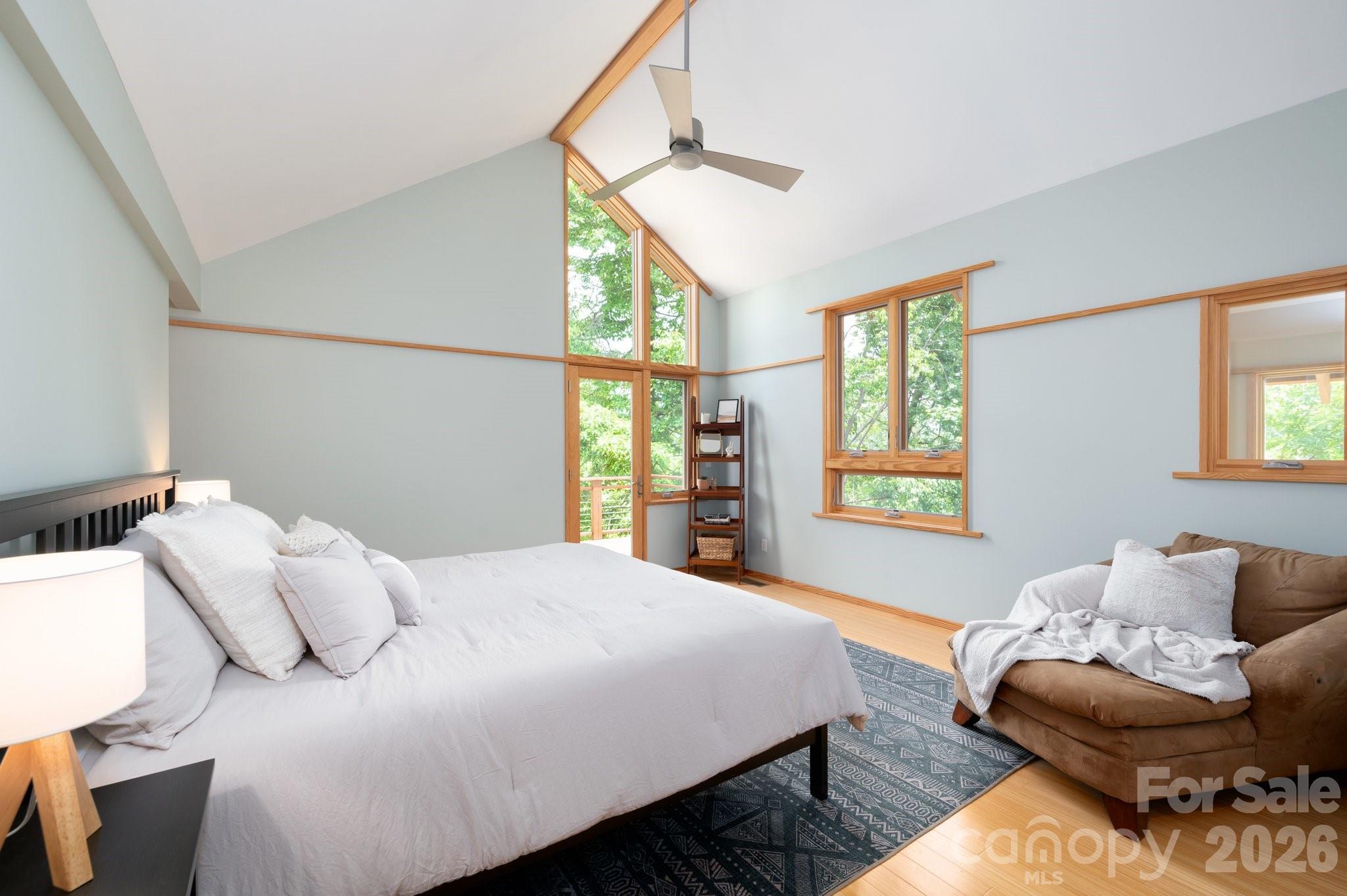 588 Long Branch Road Swannanoa, NC 28778 - Photo 24 of 46 a bedroom with a bed couch and a window