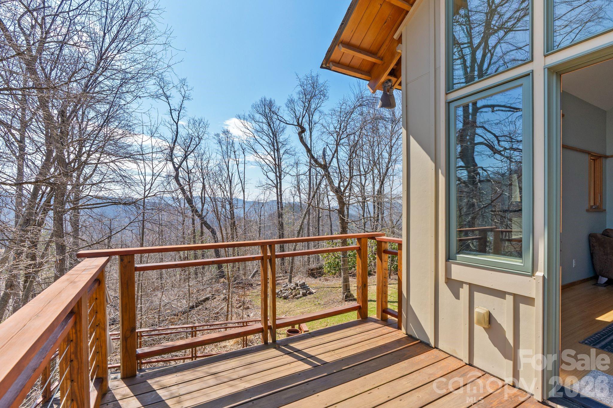 588 Long Branch Road Swannanoa, NC 28778 - Photo 25 of 46 a view of a balcony with wooden floor and fence