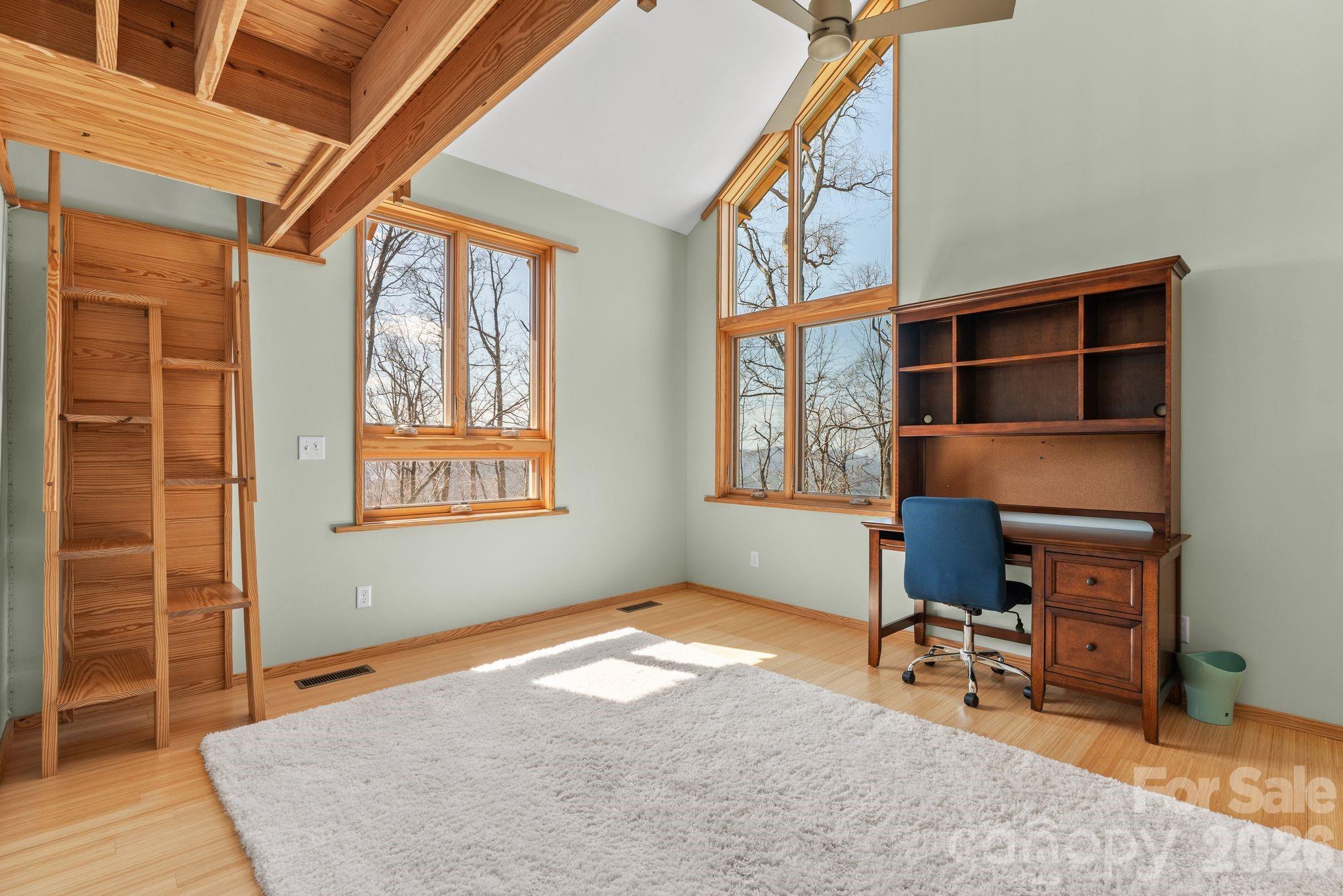 588 Long Branch Road Swannanoa, NC 28778 - Photo 28 of 46 a livingroom with workspace and a window