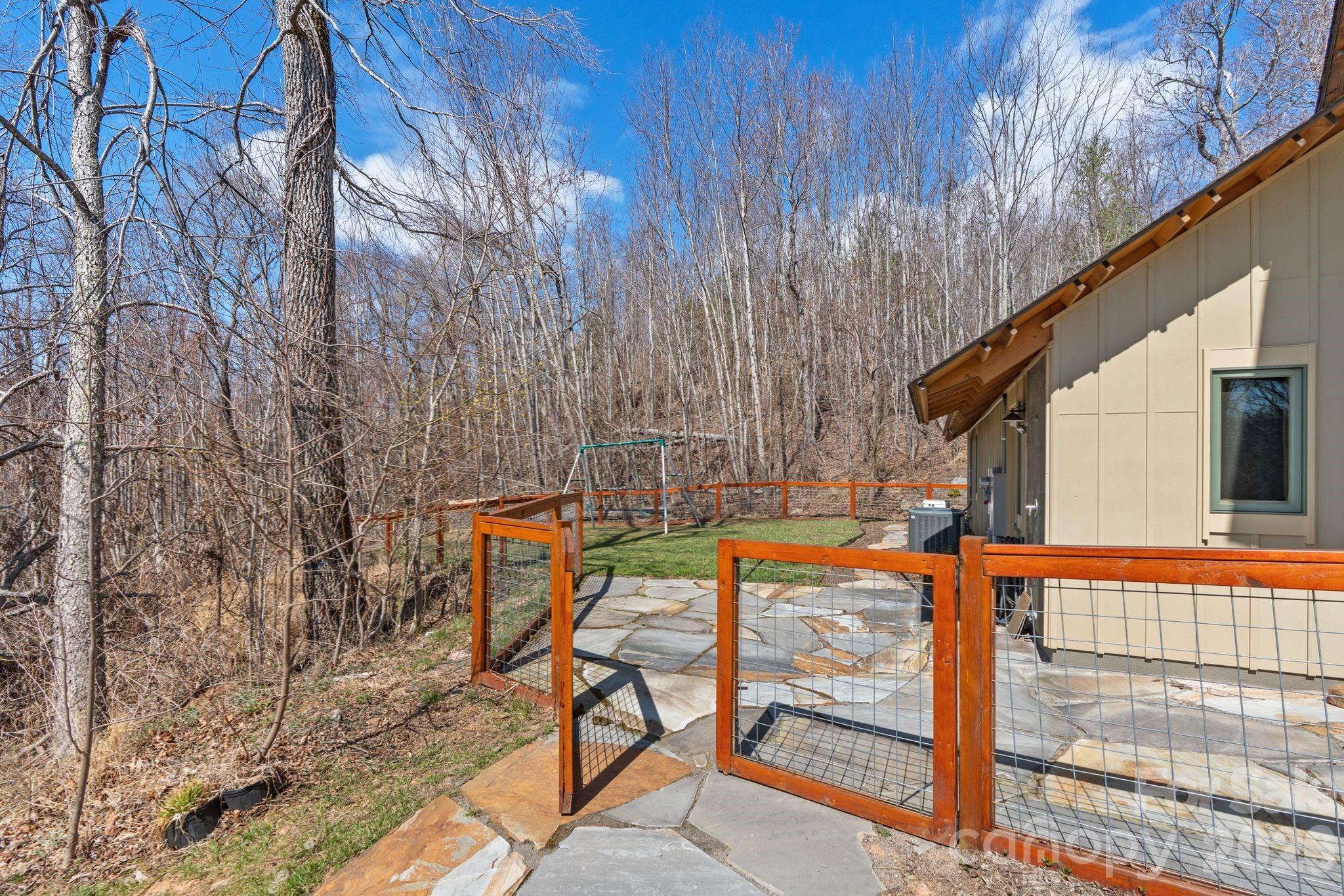 588 Long Branch Road Swannanoa, NC 28778 - Photo 36 of 46 a view of sitting area with chairs and wooden fence