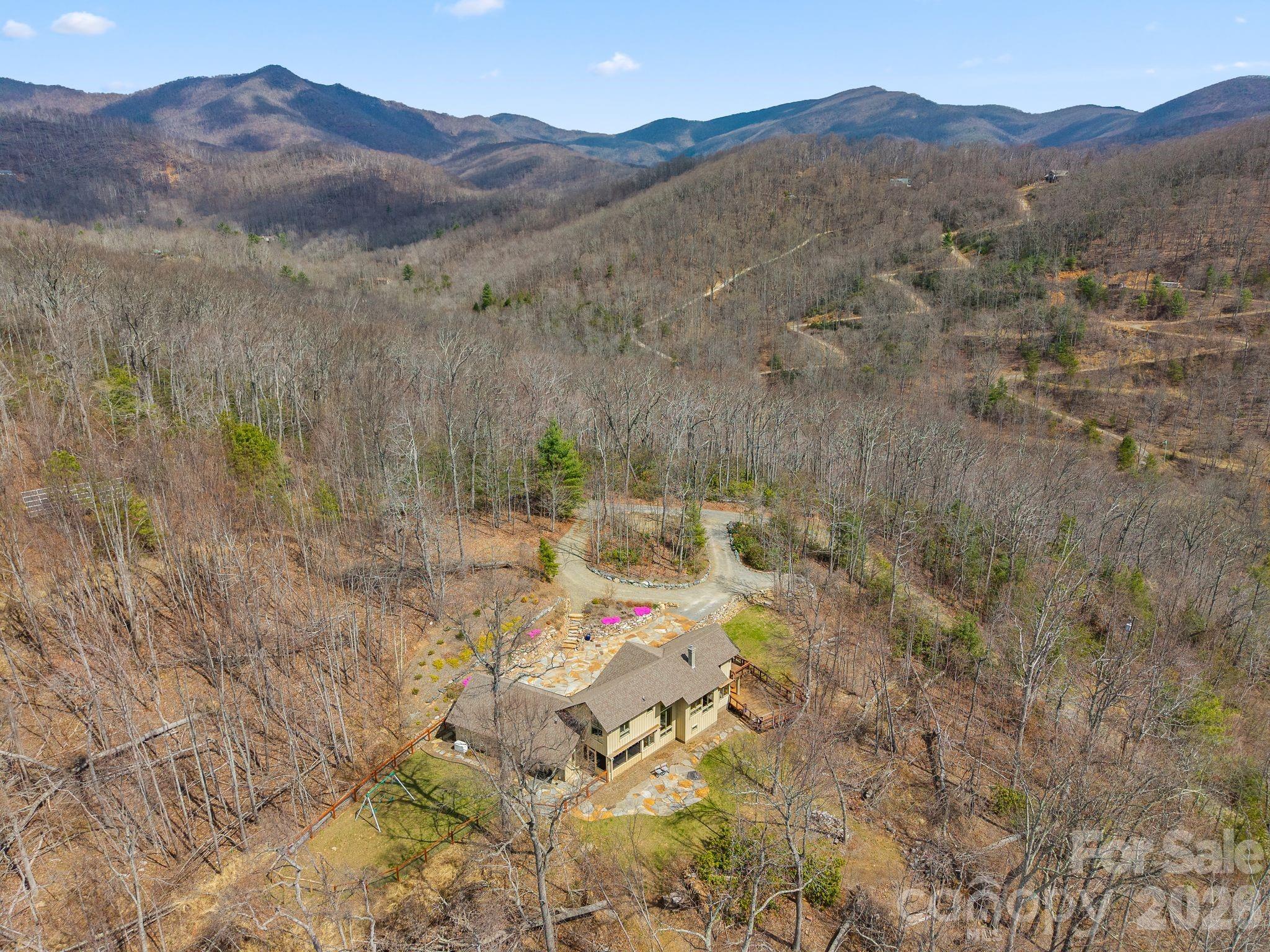 588 Long Branch Road Swannanoa, NC 28778 - Photo 44 of 46 a view of a lush green hillside and a building