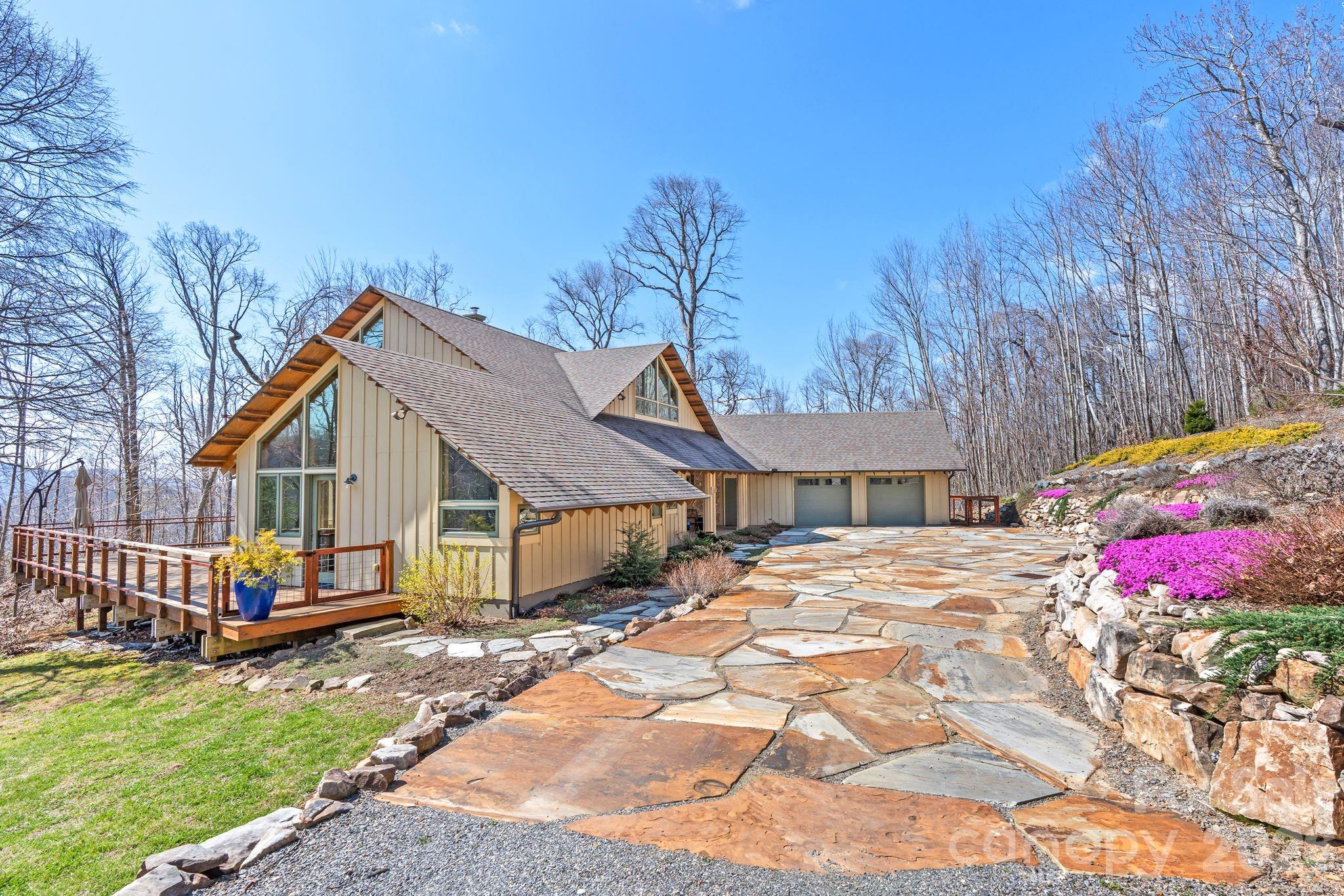 588 Long Branch Road Swannanoa, NC 28778 - Photo 45 of 46 a front view of house with yard outdoor seating and barbeque oven