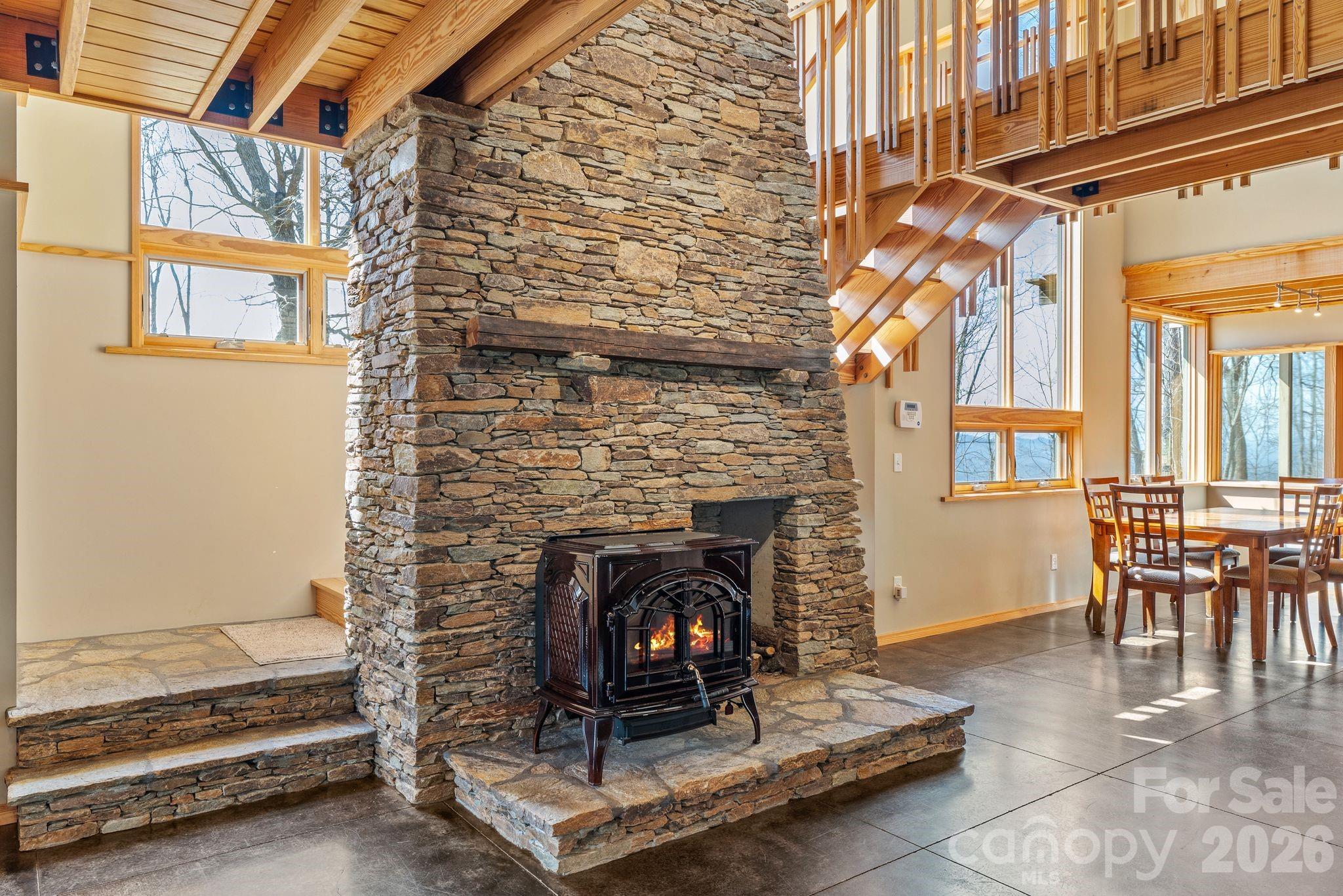 588 Long Branch Road Swannanoa, NC 28778 - Photo 5 of 46 a living room with furniture and a fireplace