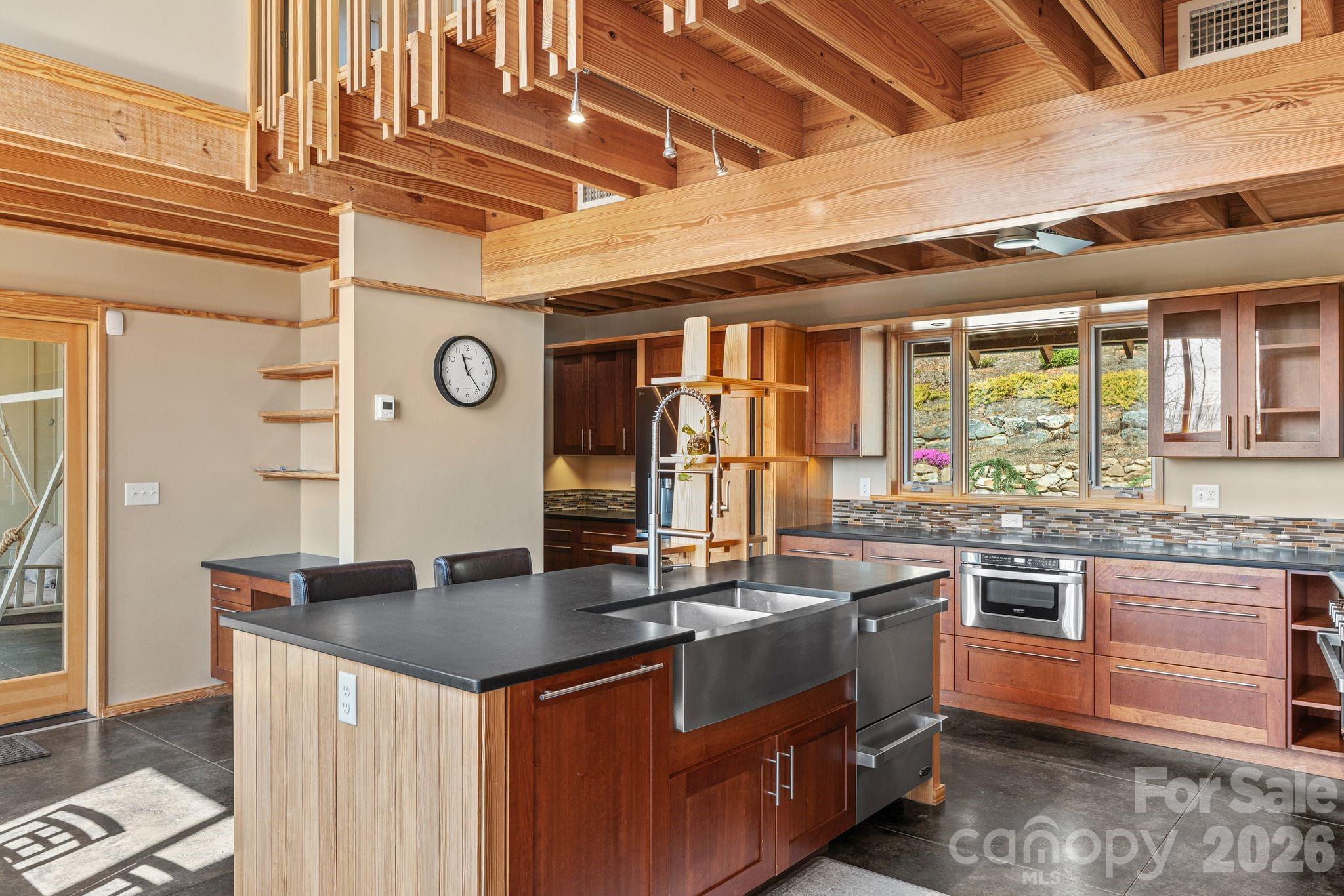 588 Long Branch Road Swannanoa, NC 28778 - Photo 10 of 46 a kitchen with stainless steel appliances granite countertop a sink a stove and a wooden cabinets
