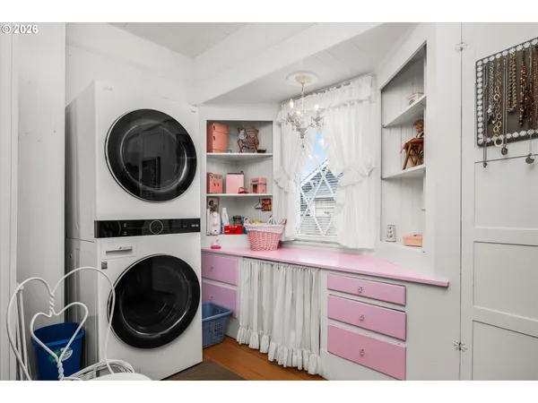 a bathroom with a sink a washer and dryer