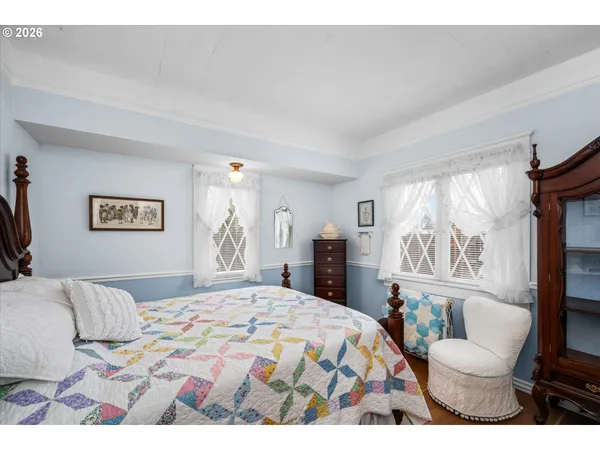 a bedroom with a bed and a couch