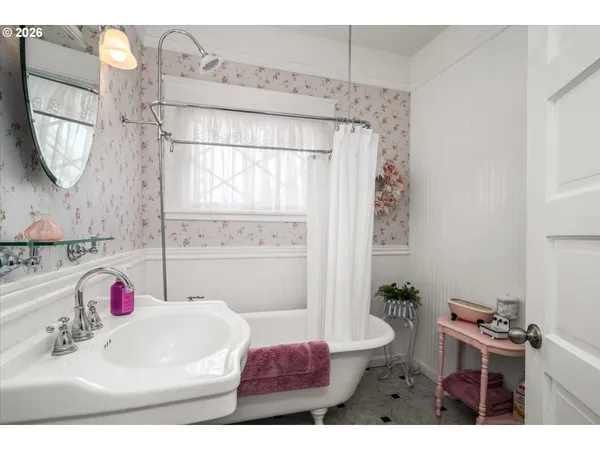 a bathroom with a sink toilet and tub