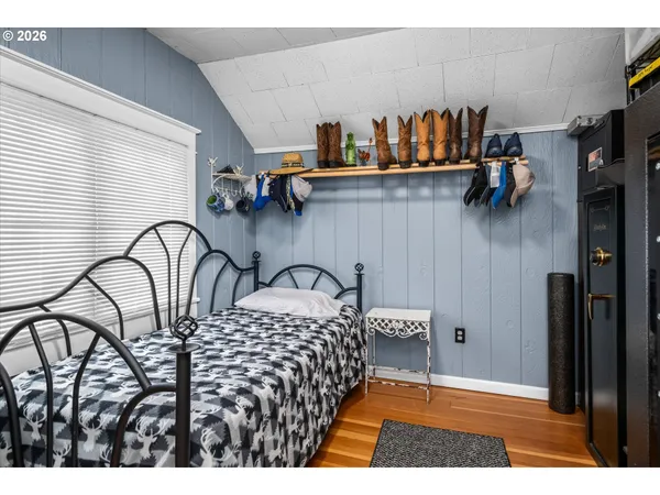 a bedroom with a bed and dresser