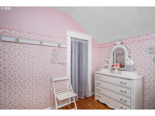 a bathroom with a sink mirror and shower