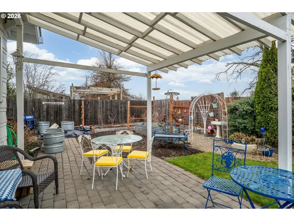 a view of swimming pool with outdoor seating and a patio