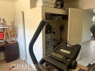 a view of a living room with furniture and a mirror