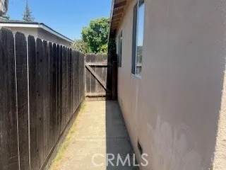 a view of balcony with wooden floor and fence