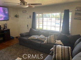 1020 West 24th Street Merced, CA 95340 - Photo 3 of 21 a living room with furniture and a window