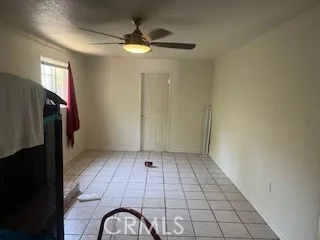 a view of entryway with a ceiling fan and window