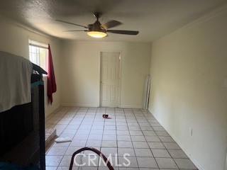 1020 West 24th Street Merced, CA 95340 - Photo 6 of 21 a view of entryway with a ceiling fan and window