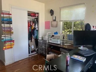 a work room with furniture and a window