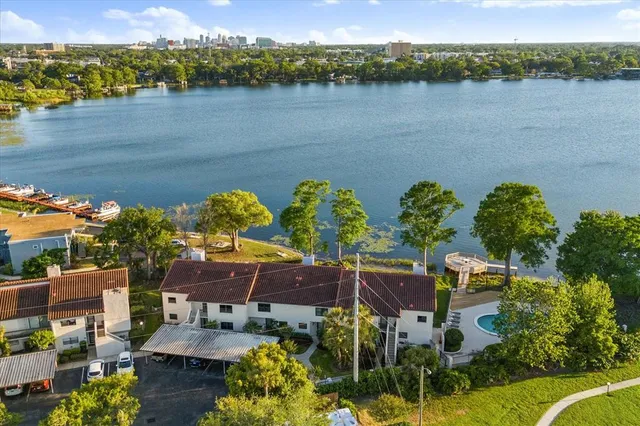 a view of a lake with couches and city view