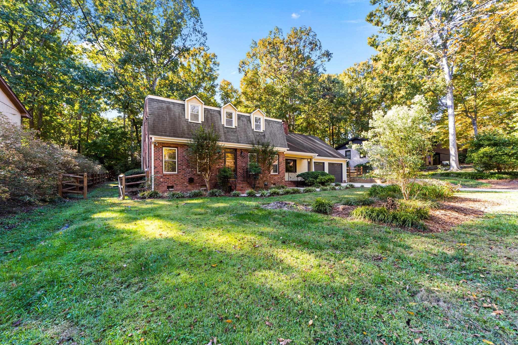 6909 Electra Drive Raleigh, NC 27607 - Photo 11 of 22 a front view of a house with garden