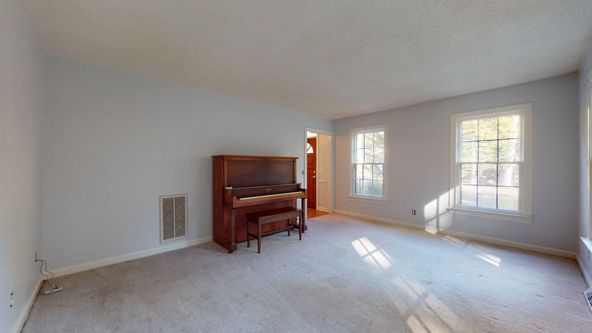 6909 Electra Drive Raleigh, NC 27607 - Photo 13 of 22 a view of a livingroom with furniture and windows