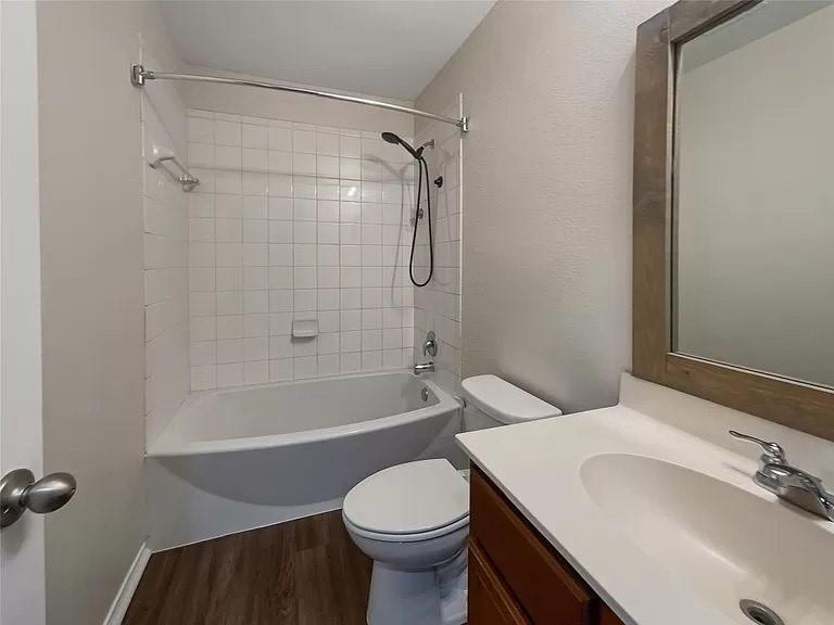 1809 Meadow Crest Drive Princeton, TX 75407 - Photo 11 of 20 a bathroom with a sink toilet and shower