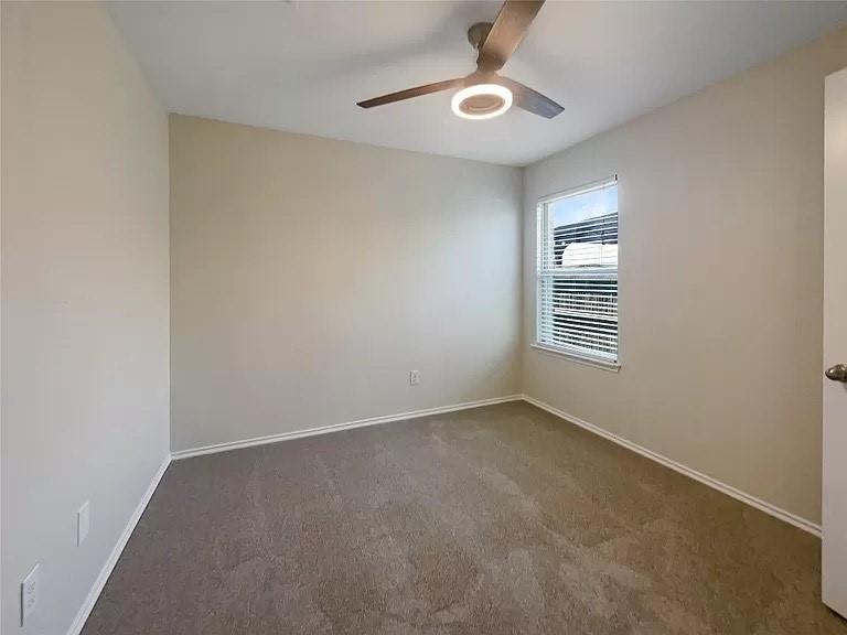 1809 Meadow Crest Drive Princeton, TX 75407 - Photo 13 of 20 an empty room with windows and fan