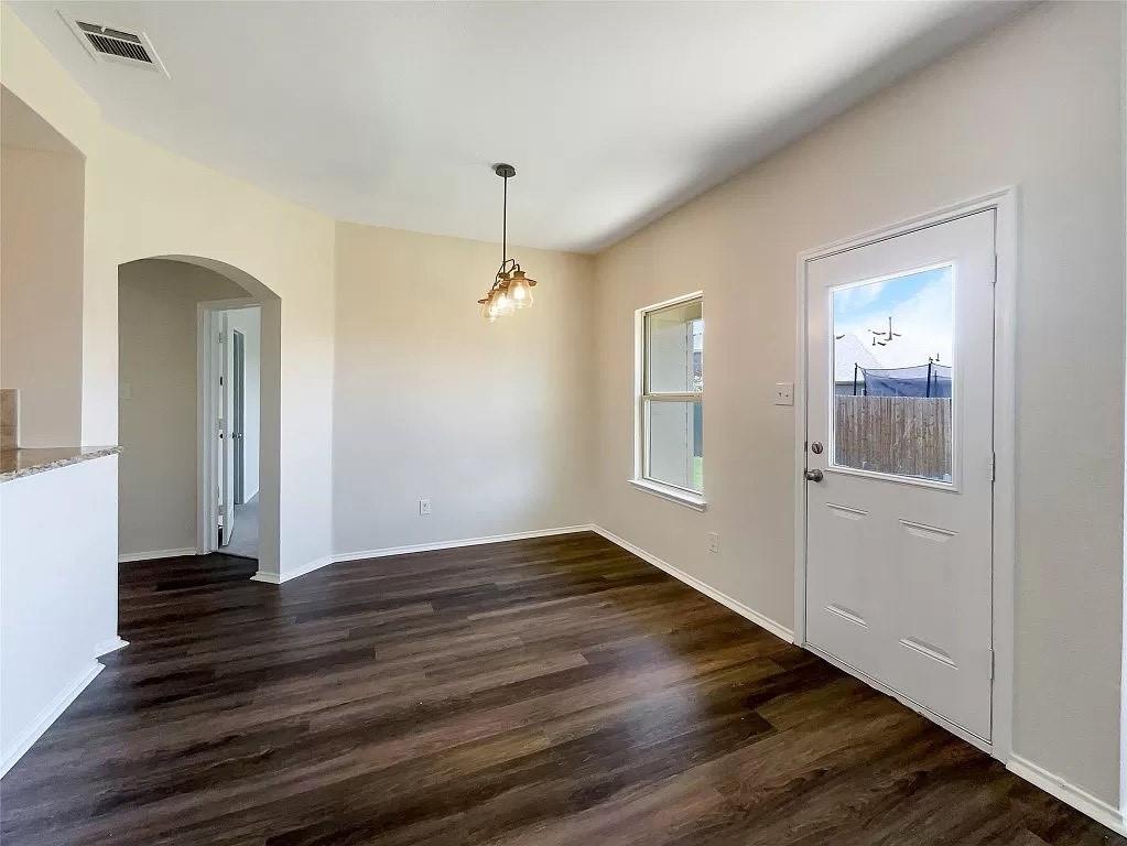 1809 Meadow Crest Drive Princeton, TX 75407 - Photo 15 of 20 wooden floor in an empty room with a window